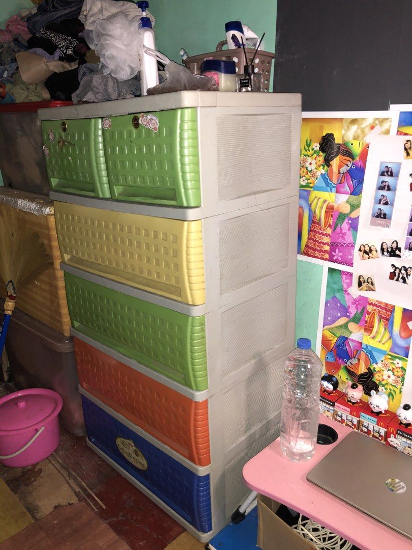 Orocan Caha de Oro 5 Layer drawer (Category: Shelves, Cabinets & Racks) located in Manila. Submitted by sellnowzumi (Listing ID 1466181727, Image 2). Description: - 5-tier colorful plastic storage cabinet - Includes yellow, green, orange, and blue drawers with a sleek grey outer frame - Top tier features 2 smaller compartments with built-in lock mechanisms - Ideal for organizing clothes, toys, and bedroom essentials - Durable, lightweight, and ea