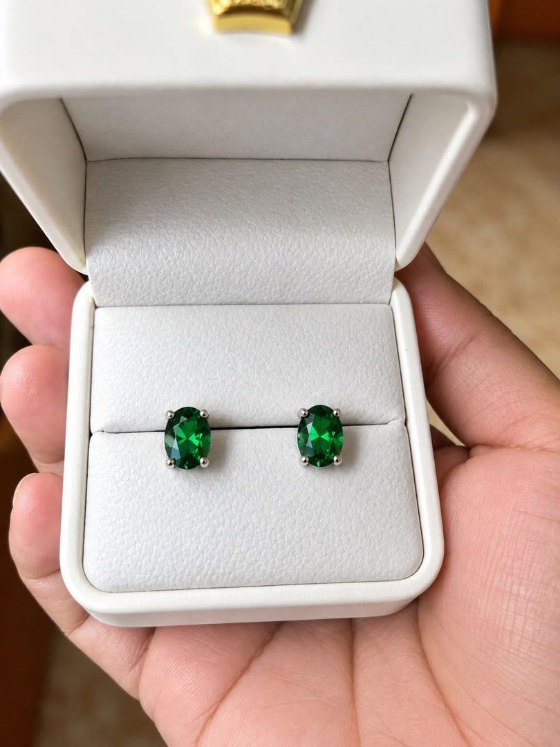 Emerald oval cut earrings/silver needle (Category: Earrings) located in Kalibo. Submitted by sunnysidegold (Listing ID 1466248331, Image 1). Description: 10x8mm stone size Oval cut silver needle copper base metal crown setting.