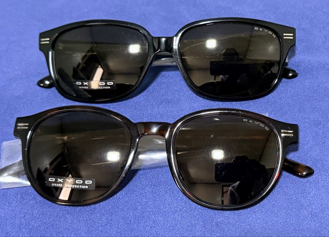 Oxydo Sunglasses (Category: Sunglasses & Eyewear) located in Dasmarinas. Submitted by toyang50 (Listing ID 1466202110, Image 1). Description: Selling two brand new pairs of Oxydo sunglasses (Model OX 1009/S, 54-16-140) in unworn condition. Includes one black frame and one tortoise shell frame, both featuring UV400 protection tags and gold-tone branding. 1200 each. .