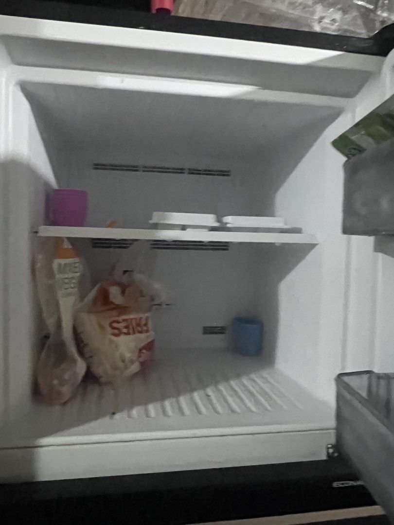 Panasonic ECONAVI Inverter Double Door Refrigerator (Category: Refrigerators and Freezers) located in Pasig City. Submitted by berna69 (Listing ID 1466233830, Image 3). Description: - Brand: Panasonic Double Door Fridge - Technology: ECONAVI Inverter (energy efficient) - Exterior: Sleek black finish with energy labels attached - Interior: Clean white compartments - Special Zones: Prime Cooling+ zone & Fresh Safe crisper drawer - Storage: Multiple