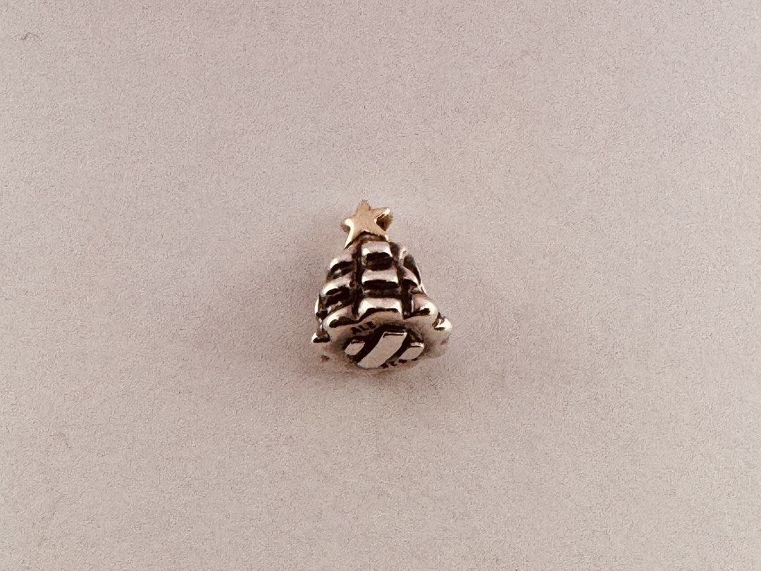 Pandora Christmas Tree Charm (790365) (Category: Charms) located in Cabanatuan. Submitted by water.withahintoflime (Listing ID 1461307055, Image 1). Description: Retired|Authentic Winter Theme Collectible S925 Body|Solid Yellow G585 Star S925 ALE Hallmark Pre-owed|No issue|Normal wear With complete packaging.