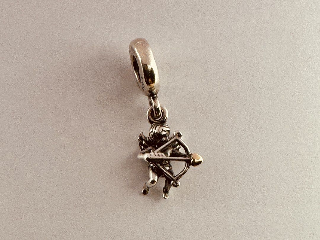 Pandora Cupid Pendant Dangle Charm (791251) (Category: Charms) located in Cabanatuan. Submitted by water.withahintoflime (Listing ID 1461261070, Image 1). Description: Retired|Authentic S925 Body|Yellow G585 Arrowhead PANDORA|S925 ALE Hallmark Pre-owed|No issue|Normal wear With complete packaging .