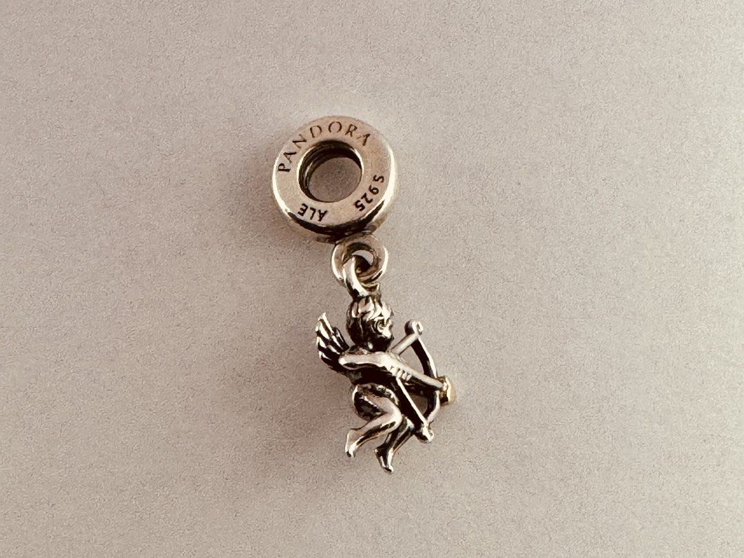 Pandora Cupid Pendant Dangle Charm (791251) (Category: Charms) located in Cabanatuan. Submitted by water.withahintoflime (Listing ID 1461261070, Image 2). Description: Retired|Authentic S925 Body|Yellow G585 Arrowhead PANDORA|S925 ALE Hallmark Pre-owed|No issue|Normal wear With complete packaging .