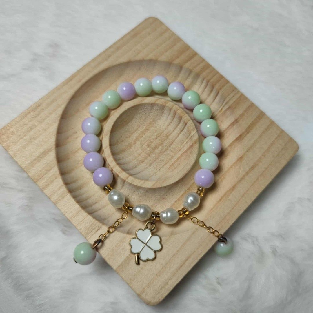 Pastel Beaded Bracelet with Four-Leaf Clover Charm (Category: Bracelets) located in Taguig. Submitted by fits.for.less (Listing ID 1466162343, Image 1). Description: 60 pesos MOP: Gcash MOD: lalamove/grab, pick-up if malapit lang.