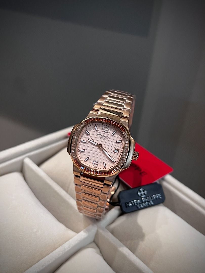 Patek Philippe Rose Gold Watch with Gemstone Bezel (Category: Luxury Watches) located in Pasig City. Submitted by wisefalcon6199 (Listing ID 1466227363, Image 2). Description: - Rose gold tone luxury watch with a stunning gemstone-set bezel in warm orange and brown tones - Textured dial featuring elegant baguette hour markers, Arabic numerals at 12 and 6, and a practical date window - Matching metal link bracelet, brand new and wrapped in protect