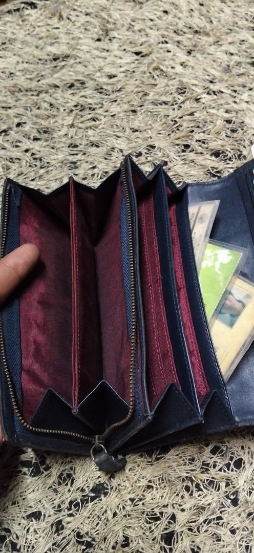 Patrick Cox Fler de Lis Long Wallet (Category: Wallets & Card holders) located in Paranaque City. Submitted by michael-08 (Listing ID 1466191882, Image 3). Description: - Authentic Patrick Cox long wallet - Eye-catching blue and gold fleur-de-lis pattern with dark leather center panel - Metal brand plate accent - Features multiple card slots, cash compartments, and a secure zipped inner pocket - Stylish maroon fabric lining - Convenient side snap