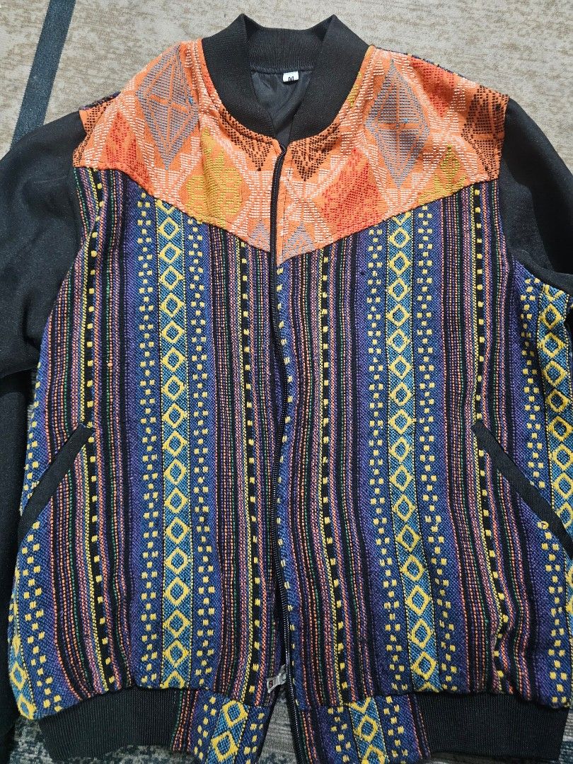 Patterned Zip-Up Bomber Jacket Size M (Category: Coats, Jackets and Outerwear) located in Manila. Submitted by villoja0615 (Listing ID 1466188269, Image 1). Description: Pre-love Balik batik bomber Jact embriodered by Itneg artistans from Abra✨ High-quality, gently used polos available at super affordable prices. No fades, no stains, ready to wear! ​📍 Condition: 9/10 (Gently used / Well-maintained) 💰 Price: 1,000 📏 Sizes: Medium 🚛 Shipping / 
