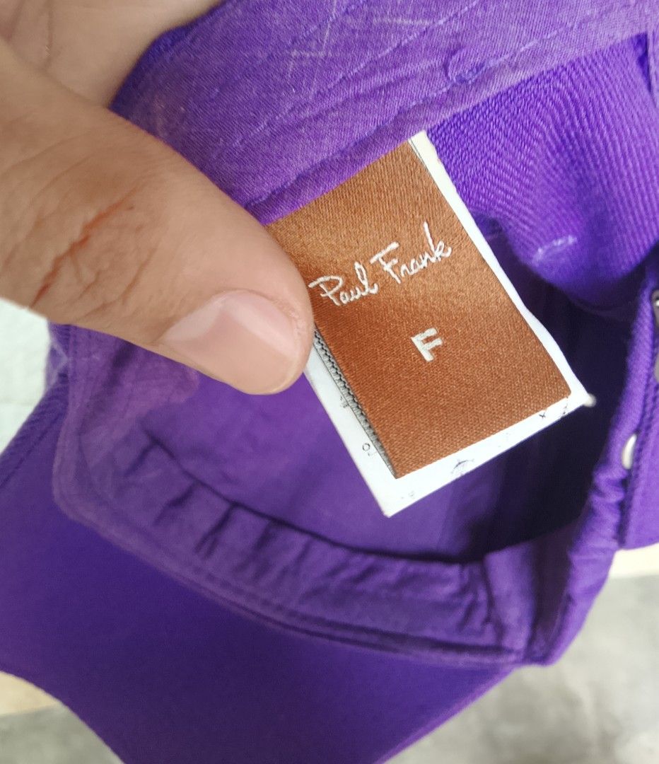 Paul Frank Purple Baseball Cap with Monkey Logo (Category: Caps & Hats) located in Manila. Submitted by keencrystal.595c28 (Listing ID 1466227509, Image 3). Description: - Authentic Paul Frank baseball cap in a vibrant purple shade - Iconic monkey face embroidery on the front panel - Stylish script lettering along the brim and side - Cute yellow character graphic embroidered on the side - Adjustable fit strap inside for comfort - Size: F (Free Si