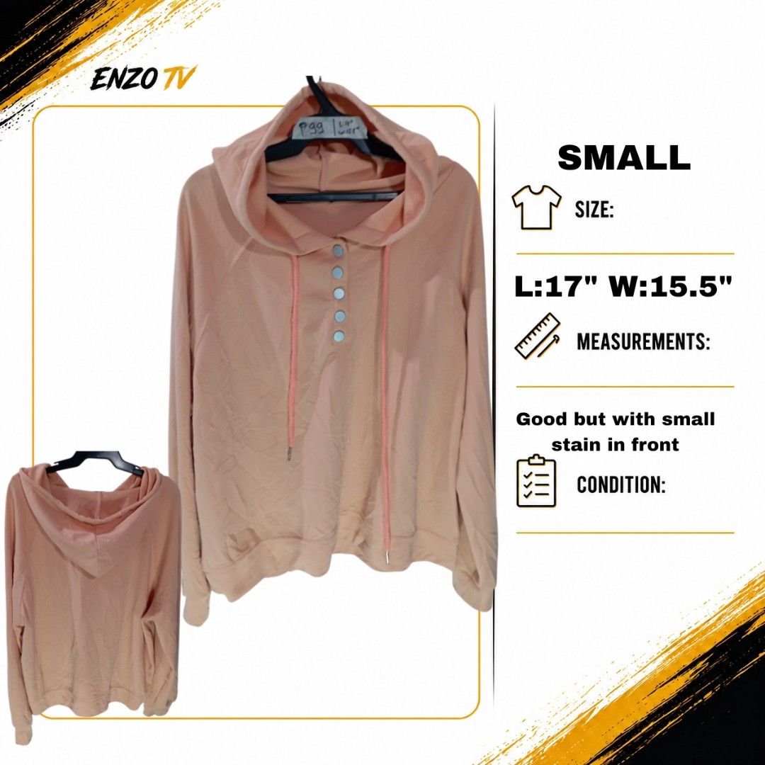 Peach Hoodie with Snap Buttons and Drawstrings Size Small (Category: Coats, Jackets and Outerwear) located in Rodriguez. Submitted by enzo.tv (Listing ID 1466326297, Image 1). Description: - Color: Peach - Size: Women's Small (Length: 17", Width: 15.5") - Design: Snap button front placket with four silver-tone buttons, matching pink drawstrings, and long sleeves - Fit: Relaxed and comfortable - Flaw: Small stain visible on the front fabric.