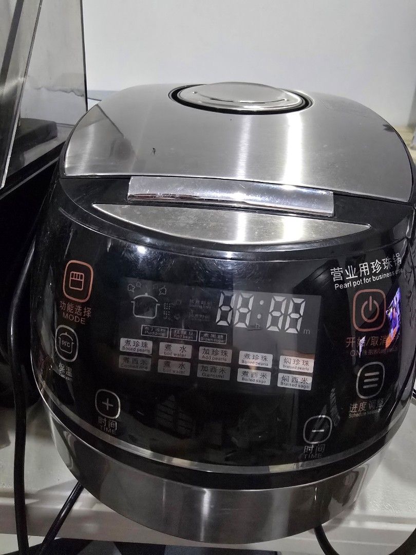 Pear cooker digital display multi-function (Category: Cookers) located in Marikina City. Submitted by happy_haulsph (Listing ID 1466156710, Image 1). Description: - Commercial pearl pot rice cooker with stylish black and metallic silver exterior - Features a digital control panel with multiple cooking modes, timers, and preset options - Powers up successfully with a clear, working LED display screen - Clean inner lid equipped with an intact silic