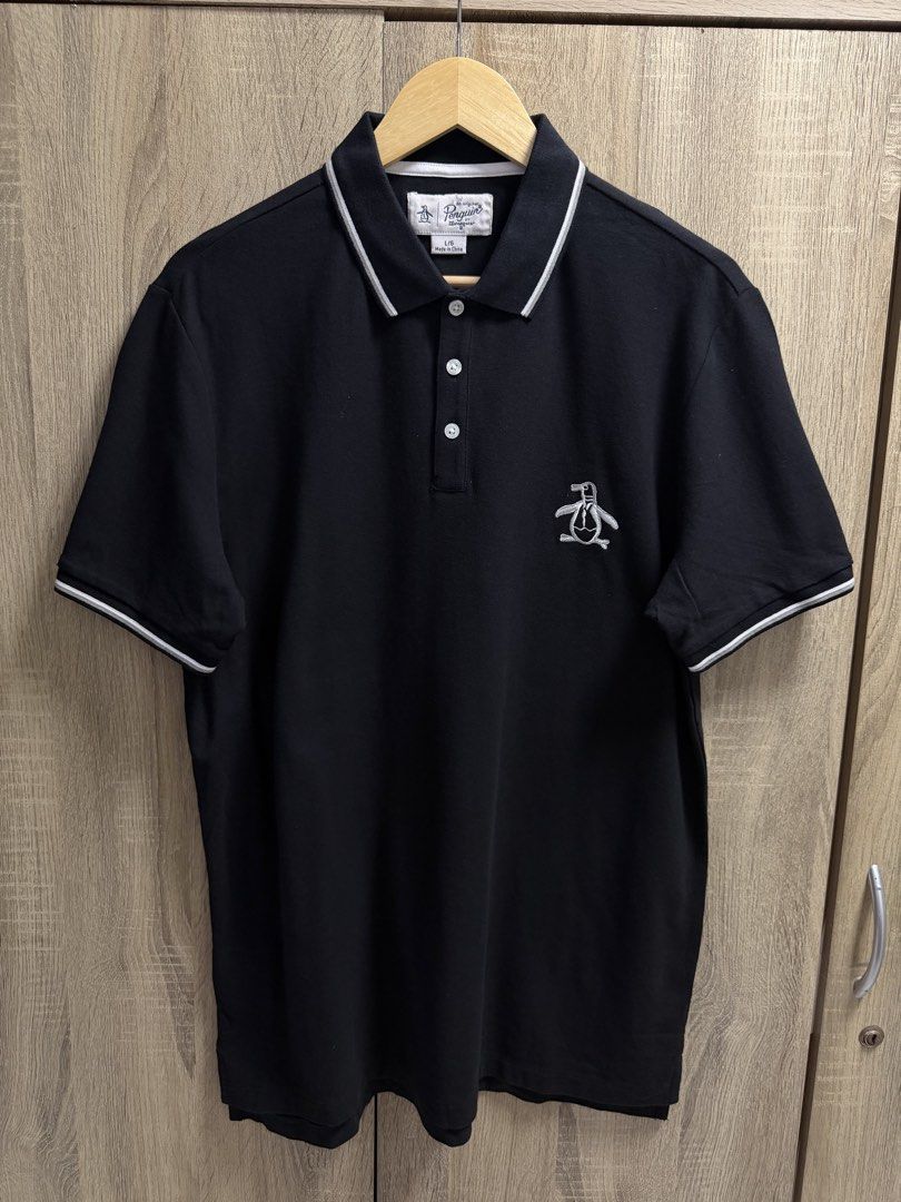 Penguin Polo Shirt (Category: Tshirts & Polo Shirts ) located in Cavite. Submitted by PRIVATE.Selection (Listing ID 1466317224, Image 1). Description: Penguin Polo Shirt Size Large W- 21.5 L- 29 Good as new no issues .