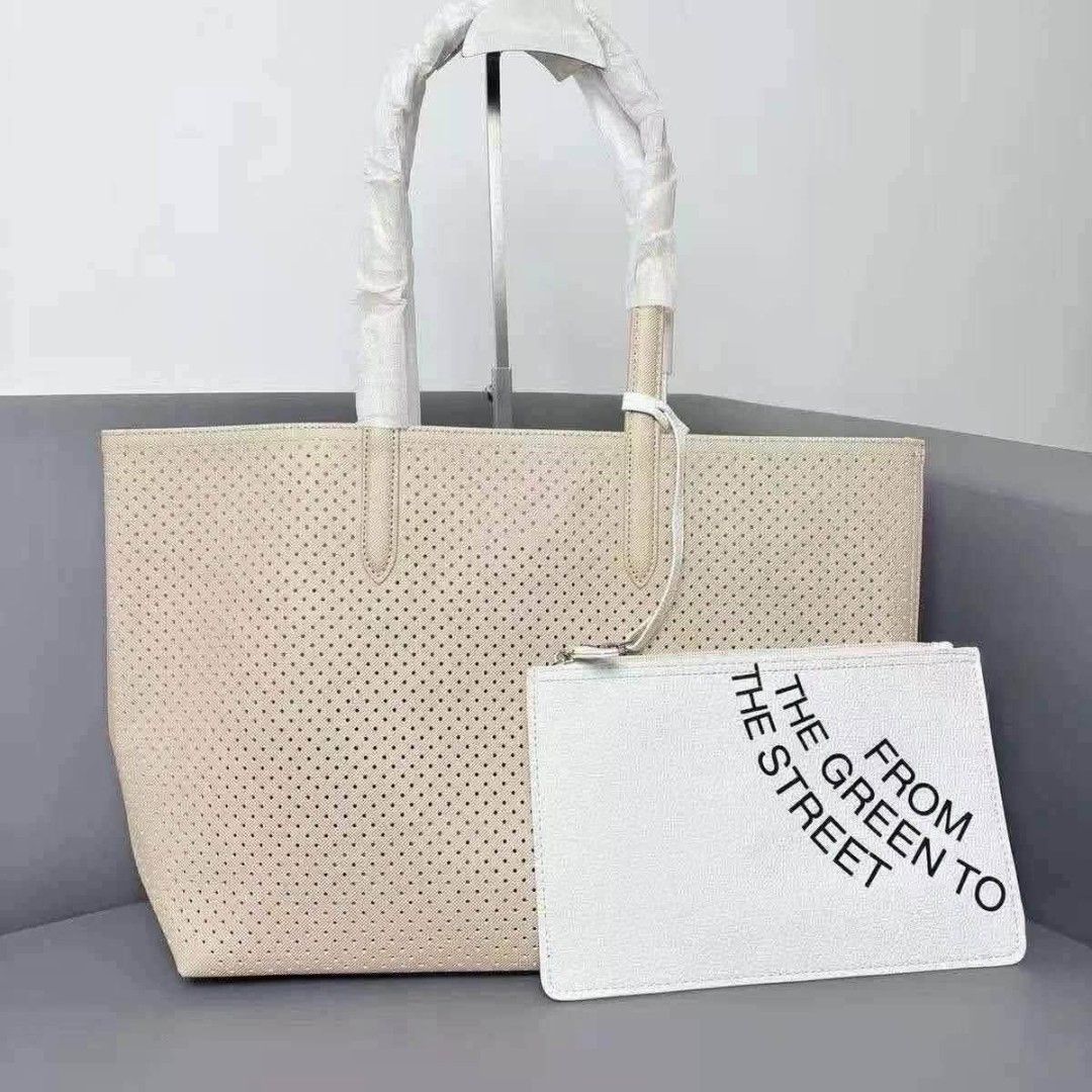 Perforated Tote Bag with Matching Pouch Set (Category: Tote Bags) located in Manila. Submitted by onlineshopmate (Listing ID 1466182892, Image 1). Description: - Trendy perforated design tote bag with matching clutch pouch - Spacious interior, perfect for daily use and errands - Secure zippered pouch attached via a slim strap - Handles wrapped in protective foam for safe shipping and comfy grip - Available color combos: Beige/White, Grey/Black, a
