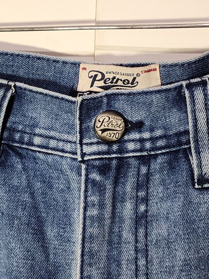 Petrol Denim Straight Jeans Size 30 (Category: Jeans) located in Meycauayan. Submitted by MP_Shop (Listing ID 1466241784, Image 3). Description: - Brand/Style: Petrol denim jeans in blue wash - Size: Tagged size 30 - Fit: Mid-rise with standard button closure - Details: Classic five-pocket design, stitched back pockets, and branded leather patch - Material: Cotton blend with stretch - Condition: Clean and well-maintained.
