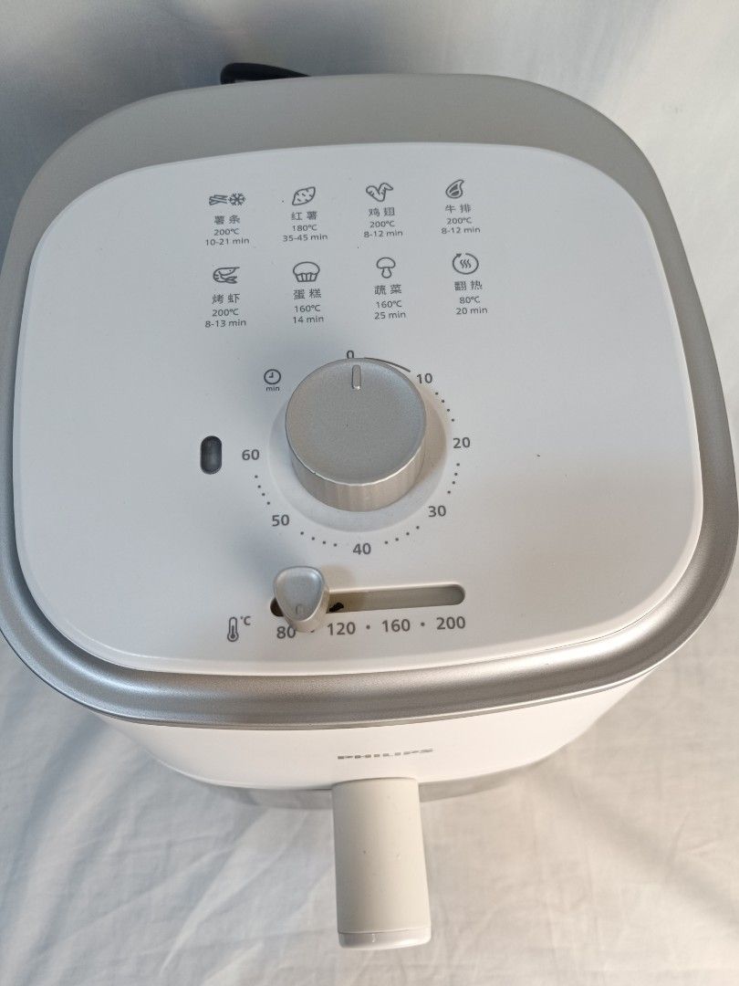 Philips Air Fryer White RapidAir Technology (Category: Fryers) located in Baguio. Submitted by clothes.over.bros.ph_2020 (Listing ID 1466268601, Image 2). Description: - Authentic Philips Air Fryer in clean white finish - Dual manual knobs for easy time and temperature control - Built-in viewing window on the basket to monitor food while cooking - Clean internal heating element and fan - Includes non-stick basket and removable mesh tray insert - 