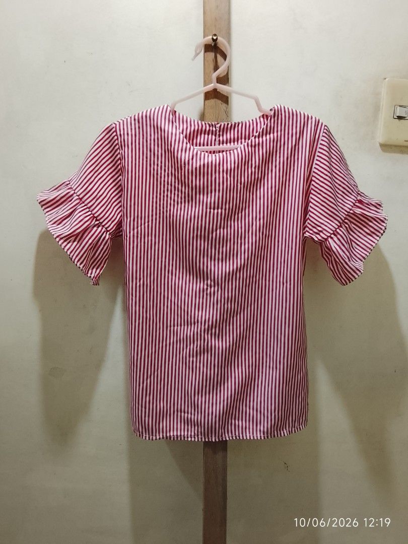 Pink and White Striped Ruffle Sleeve Top (Category: Blouses) located in Valenzuela. Submitted by beth45.phoenix (Listing ID 1466245266, Image 1). Description: - Pink and white vertical striped design - Short ruffled sleeves with a classic scoop neckline - Relaxed, comfortable fit - Lightweight fabric ideal for sunny weather - Easy to pair with your favorite jeans or shorts - PM for measurements or more details!.