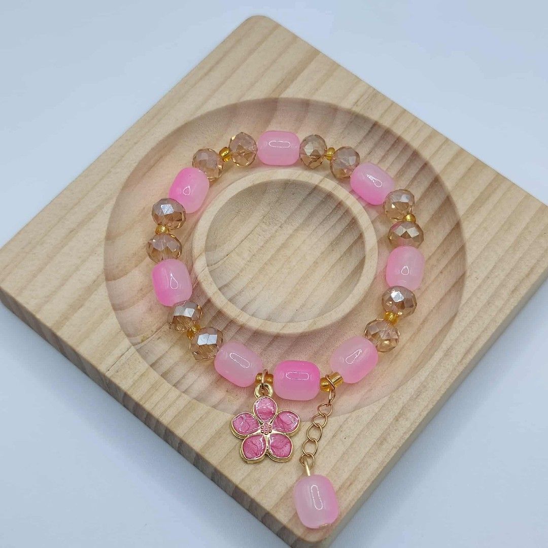 Pink Beaded Bracelet with Cherry Blossom Charm (Category: Bracelets) located in Taguig. Submitted by fits.for.less (Listing ID 1466163003, Image 1). Description: 60 pesos MOP: Gcash MOD: lalamove/grab, pick-up if malapit lang.