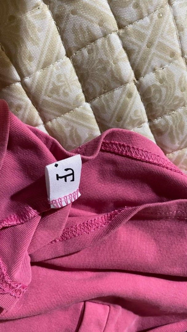 Pink Crop Top with Button Details (Category: Others Tops) located in Pagadian. Submitted by kahtlopez47867 (Listing ID 1466318329, Image 2). Description: - Color: Bright pink - Style: Short sleeve crop top with scoop neckline - Details: 5 matching front buttons - Material: Stretchy ribbed cotton - Pairing: Perfect with high-waisted jeans or skirts.
