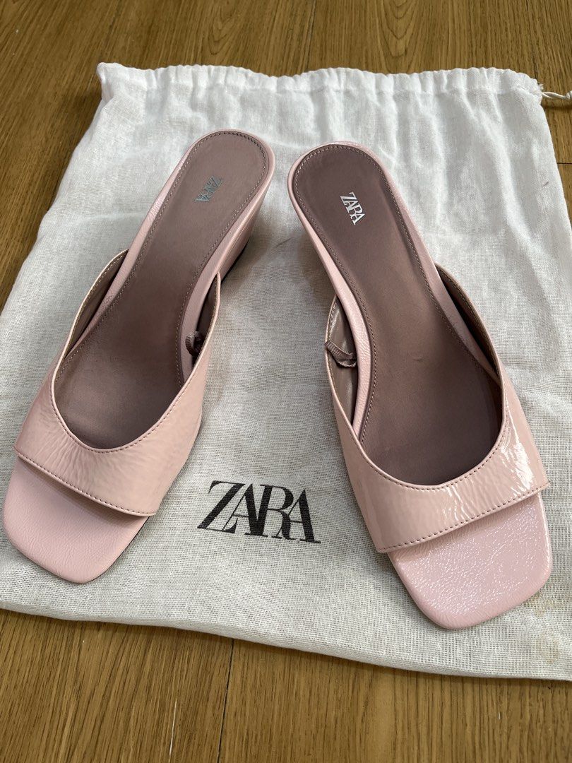 Pink Patent Wedge Sandals (Category: Flats & Sandals) located in Pasig City. Submitted by ___she___ (Listing ID 1466182773, Image 1). Description: - Style: Slip-on slide sandals - Color: Soft pink - Material: Glossy patent finish upper straps - Heel: Low wedge design for all-day comfort - Condition: brand new but no tag Clean soles and insoles - Inclusions: Original dust bag included.
