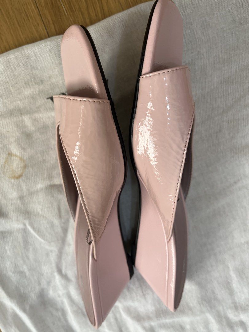 Pink Patent Wedge Sandals (Category: Flats & Sandals) located in Pasig City. Submitted by ___she___ (Listing ID 1466182773, Image 3). Description: - Style: Slip-on slide sandals - Color: Soft pink - Material: Glossy patent finish upper straps - Heel: Low wedge design for all-day comfort - Condition: brand new but no tag Clean soles and insoles - Inclusions: Original dust bag included.