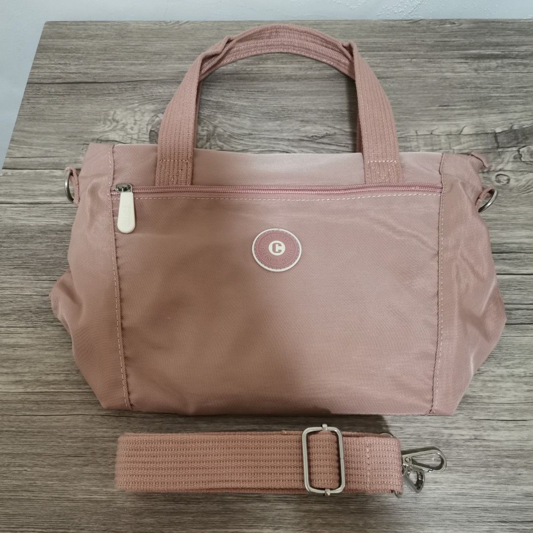 Pink Shoulder Bag (Category: Shoulder Bags) located in Bacoor. Submitted by bloomingpetals (Listing ID 1466200733, Image 1). Description: Pink Shoulder Bag / Handbag / Slingbag ₱400 FIXED PRICE • Like new / excellent condition • No issues • Still in the same condition as when I bought it • Clean and well-kept • Soft pink color • Can be hand-carried or worn with the included adjustable strap • Spacious main compartment • Front zipper pocket • Secu