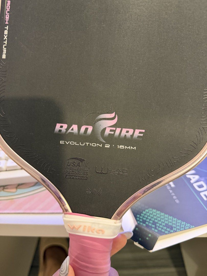 Pink Wika Bao Fire Evolution 2 (Category: Racket and Ball Sports) located in Manila. Submitted by studentpreloved (Listing ID 1466330004, Image 2). Description: - only used for 2 mos - with free new overgrip (blue) - rfs: upgraded paddle.