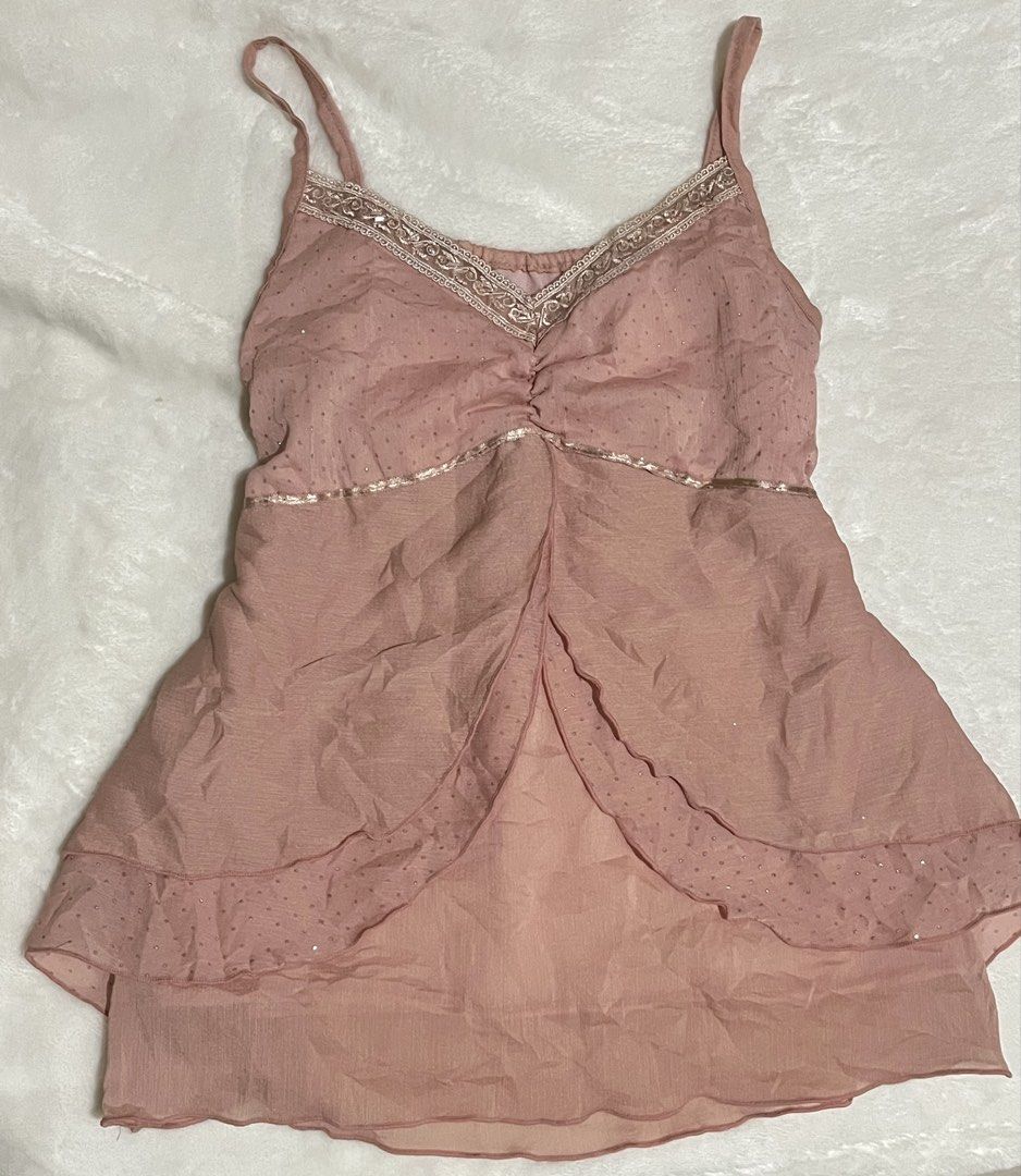 Pink Y2K Cami Layered Top (Category: Sleeveless) located in Cagayan de Oro. Submitted by prelovedbynmei (Listing ID 1466278813, Image 1). Description: - Color: Pale Dusty pink with sparkly silver swiss dots - Material: Lightweight, flowy chiffon - Details: spaghetti straps, ruffled v-neckline, metallic trim under bust, high-low layered peplum hem - Style: Perfect for summer layering or going out - Condition: Excellent (ready to ship!).