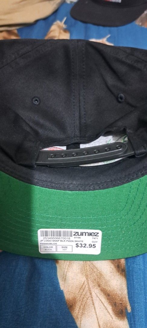Pizza Skateboards Snapback Cap Black (Category: Caps & Hats) located in San Fernando, Camarines Sur. Submitted by ladderaya (Listing ID 1466232175, Image 2). Description: - Brand: Pizza Skateboards - Style: Black snapback hat with adjustable plastic strap - Design: Bold 'PIZZA' embroidery in green, white, and red with Japanese characters - Details: Classic green underbrim and clean interior lining with brand tag - Condition: Brand new with origin