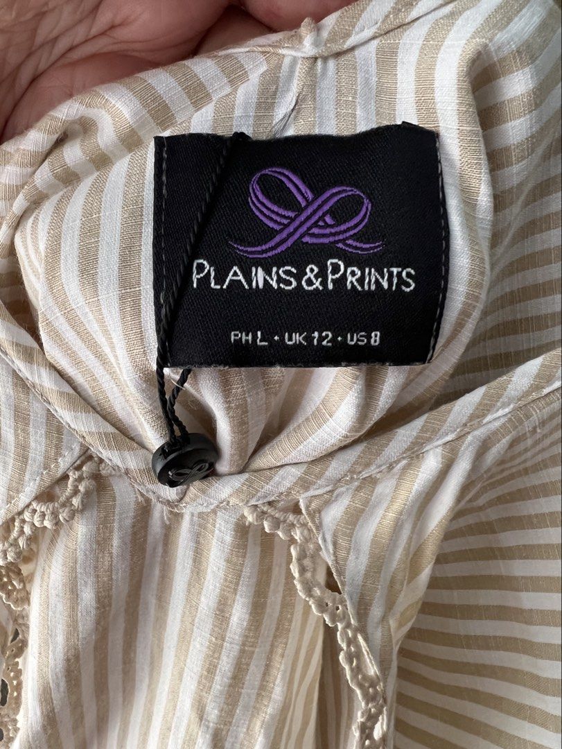 Plains & Prints Beige Striped Ruffle Blouse Large (Category: Blouses) located in Davao. Submitted by bengscloset (Listing ID 1466205036, Image 2). Description: Brand: Plains & Prints Color: Beige and white stripes Size: L, UK 12, US 8 Condition: Clean and well-kept 📌 No rush shipping. 📦 Shipping fee c/o buyer. 📍Davao City 💌 Feel free to message me for additional photos/details. Thank you for checking out my listing! ♡.