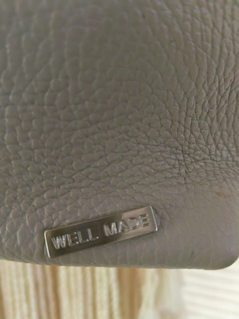 Pollen Korean Grey Leather Backpack with Canvas Straps (Category: Backpacks) located in Davao. Submitted by gelleevanelli (Listing ID 1466244010, Image 2). Description: Grey pebbled leather backpack from Pollen. Cream canvas adjustable straps with metal hardware. Top carry handle. Metal brand stamp on front and small metal logo plate at the bottom corner. Scuff marks on the top corner leather edge..