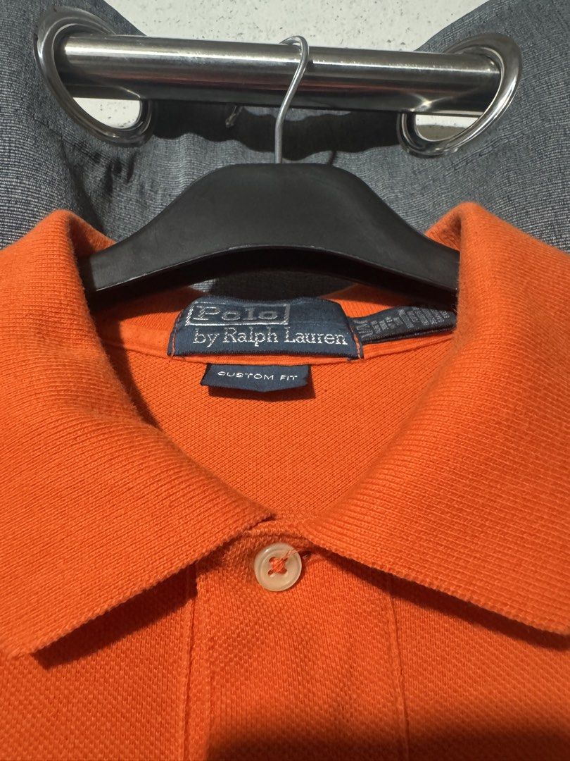 SOLD (Category: Tshirts & Polo Shirts ) located in Manila. Submitted by jackel15 (Listing ID 1466296529, Image 2). Description: - Brand: Polo Ralph Lauren - Color: Vibrant orange - Fit: Custom fit, short sleeve - Details: Classic collar, button placket, small green embroidered pony logo - Measurements: 20 inches width x 29.5 inches length - Condition: Excellent casual wear.