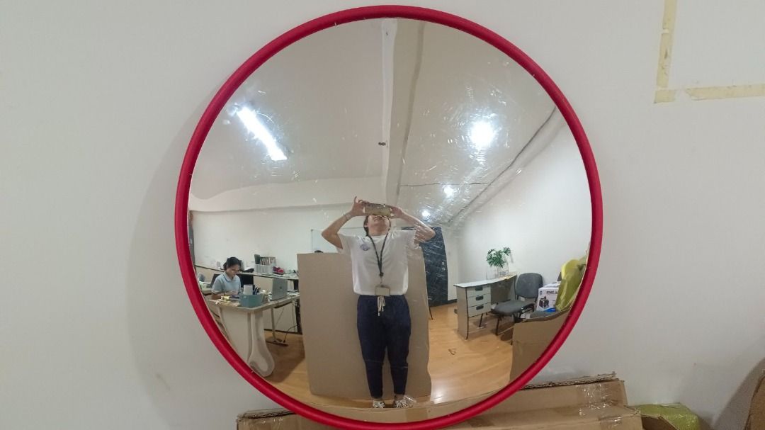 Polycarbonate Convex Mirror with Protective Film (Category: Mirrors) located in Manila. Submitted by cyrenejoye (Listing ID 1466158081, Image 2). Description: - Polycarbonate convex mirror for wide-angle safety viewing - Clear reflection once the protective film is peeled off - High-visibility red frame border around the edge - Ideal for driveways, parking lots, and blind spots - Call 0916-262-3004 for inquiries.