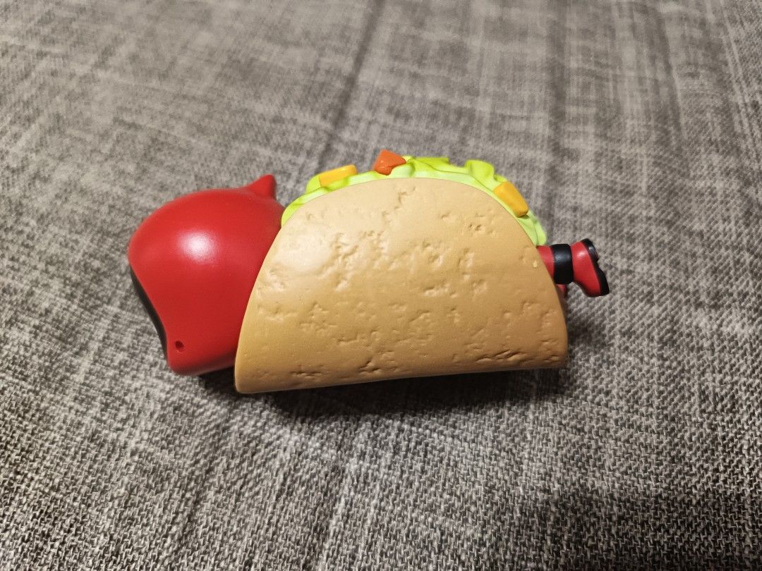 POP MART Marvel Deadpool Mini Figure Taco Deadpool Series (Category: Designer & Blind Box Toys) located in Bocaue. Submitted by lalamovexthriftselect (Listing ID 1466218218, Image 3). Description: - Authentic POP MART x Marvel Deadpool Taco collectible figure - Adorable design featuring Deadpool dressed as a taco with detailed fillings and boots - Official POP MART and MARVEL stamping on the bottom - Compact size, perfect for Marvel and designer 