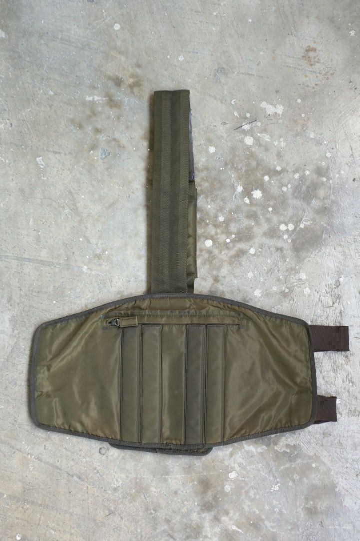 Prada - F/W 99 - Utility Harness Bag (Category: Luxury Bags & Wallets) located in Manila. Submitted by graymatter_ (Listing ID 1466235679, Image 3). Description: Prada - F/W 99 - Utility Harness Bag runway piece in olive colorway Tagged Size: One Size Condition: Rank AB Flaws: Dark Spots on Nylon Body, Minor Scuffs on Leather, Loose Stitching Around Zip Area Material: Tessuto Nylon Zipper: Lampo Made in: Italy .