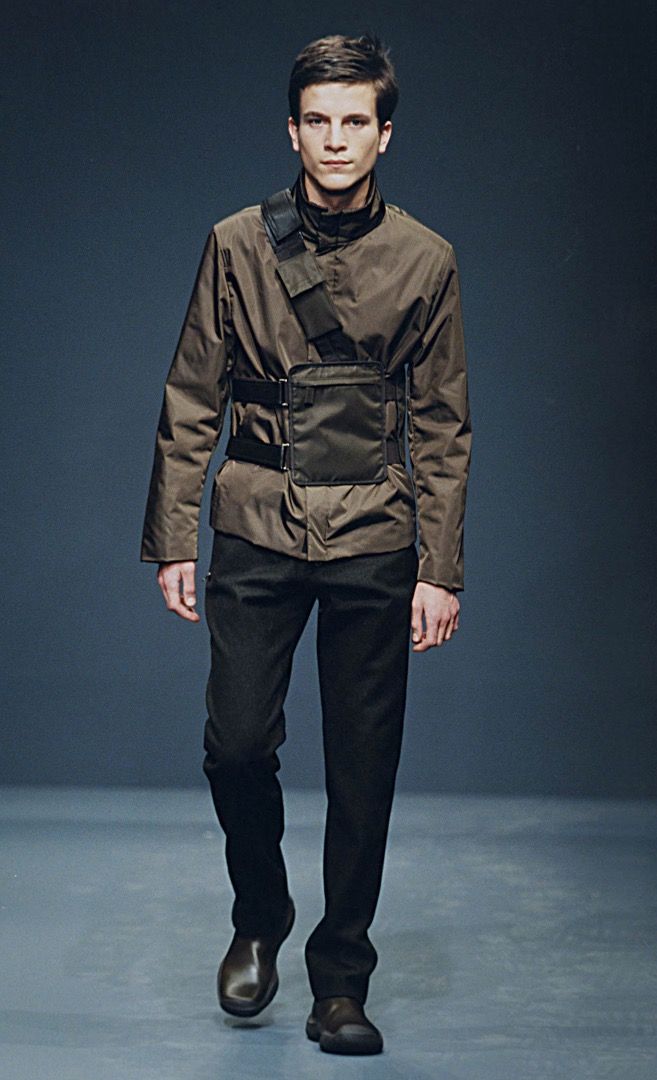 Prada - F/W 99 - Utility Harness Bag (Category: Luxury Bags & Wallets) located in Manila. Submitted by graymatter_ (Listing ID 1466235679, Image 1). Description: Prada - F/W 99 - Utility Harness Bag runway piece in olive colorway Tagged Size: One Size Condition: Rank AB Flaws: Dark Spots on Nylon Body, Minor Scuffs on Leather, Loose Stitching Around Zip Area Material: Tessuto Nylon Zipper: Lampo Made in: Italy .