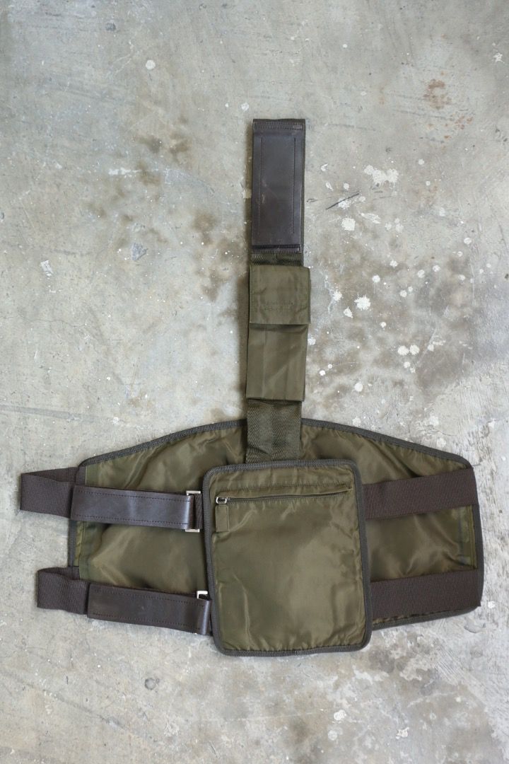 Prada - F/W 99 - Utility Harness Bag (Category: Luxury Bags & Wallets) located in Manila. Submitted by graymatter_ (Listing ID 1466235679, Image 2). Description: Prada - F/W 99 - Utility Harness Bag runway piece in olive colorway Tagged Size: One Size Condition: Rank AB Flaws: Dark Spots on Nylon Body, Minor Scuffs on Leather, Loose Stitching Around Zip Area Material: Tessuto Nylon Zipper: Lampo Made in: Italy .