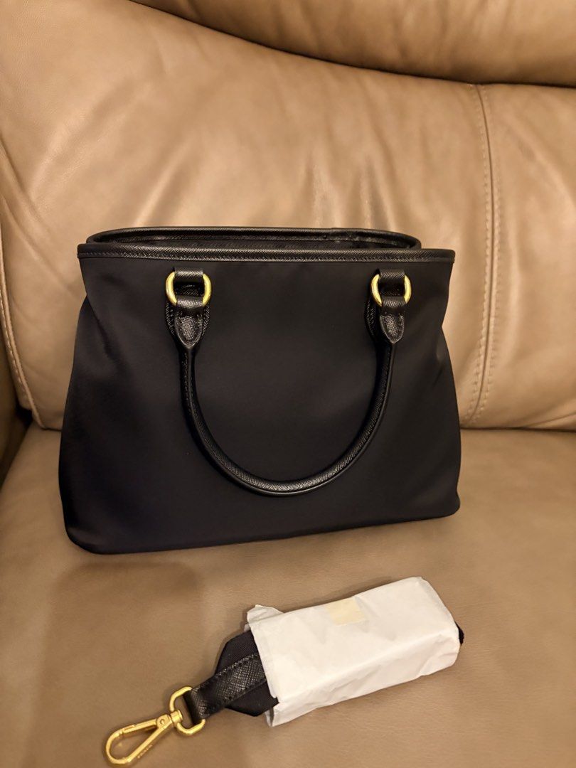 Prada Black Nylon Tote Bag With Gold Hardware (Category: Luxury Bags & Wallets) located in Makati City. Submitted by decluttering_28 (Listing ID 1466255051, Image 3). Description: Brand new Complete inclusions With receipt Bought from prada new york.