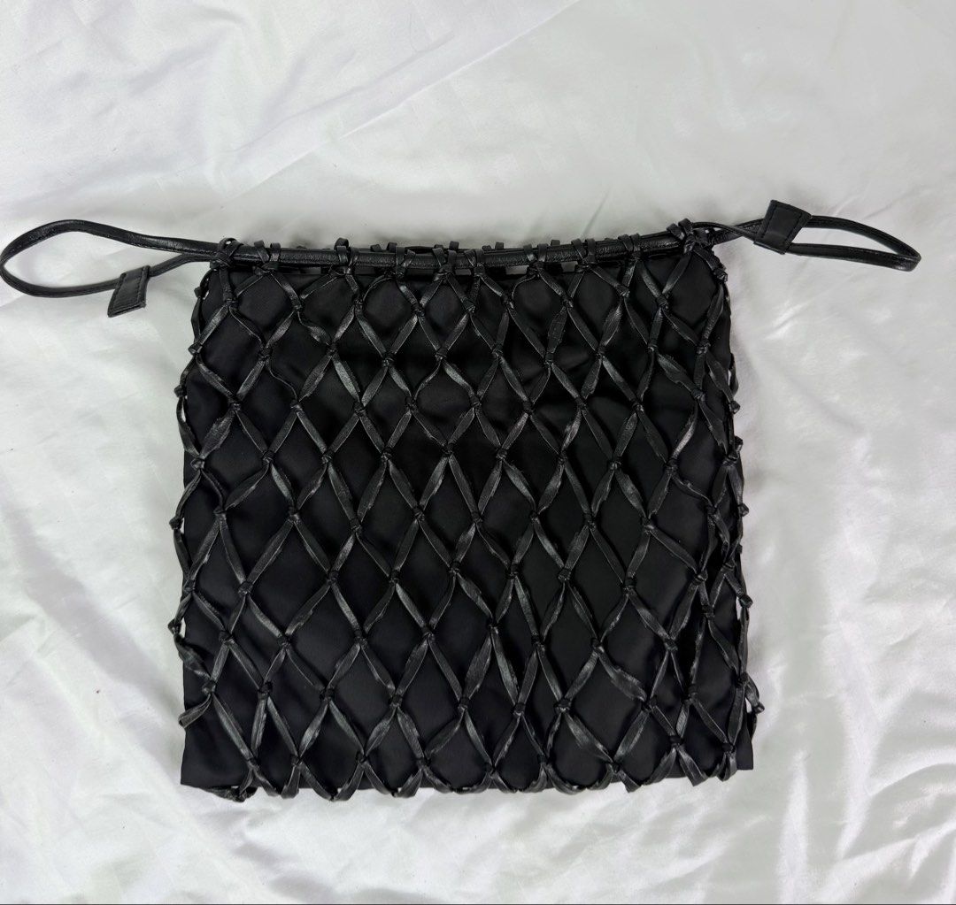 Prada fishnet with provided chain (Category: Purses & Pouches) located in Makati City. Submitted by moiobsession (Listing ID 1466270693, Image 2). Description: with provided silver long crossbody chain rare fish net bag. with white tag pa .