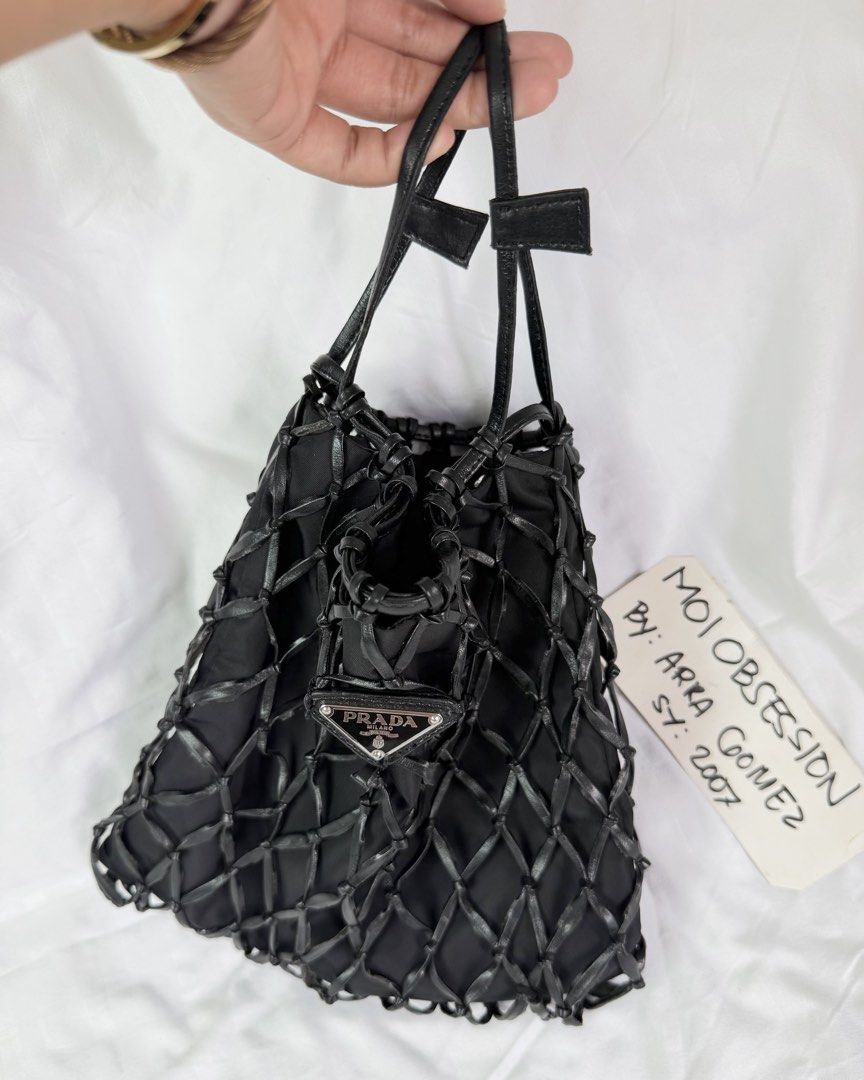 Prada fishnet with provided chain (Category: Purses & Pouches) located in Makati City. Submitted by moiobsession (Listing ID 1466270693, Image 1). Description: with provided silver long crossbody chain rare fish net bag. with white tag pa .