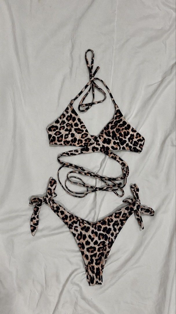 Preloved Leopard Print String Bikini Set | S (Category: Bikinis & Swimsuits) located in Paranaque City. Submitted by declutterwdai (Listing ID 1466244869, Image 1). Description: Leopard Print 2-Piece String Bikini Set perfect for beach days, pool trips, and vacations! • 2-piece set — top & bottom • Leopard print design • Adjustable tie straps • Triangle bikini top • Tie-side bikini bottoms • Lightweight & comfortable 📍 Location: Parañaque City �