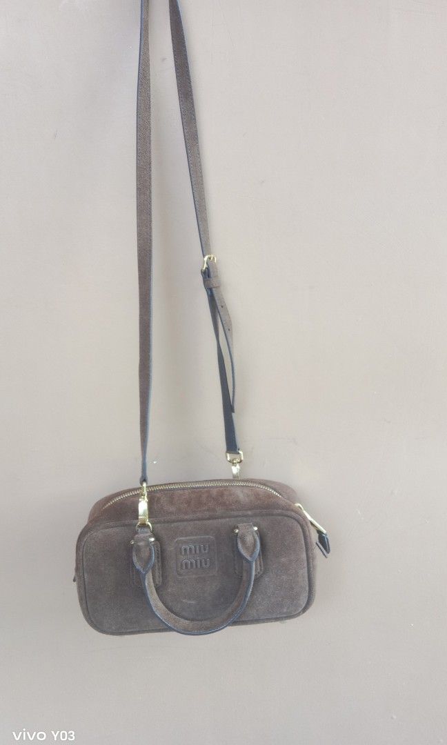 Preloved miumiu 2way bag (Category: Luxury Bags & Wallets) located in Cabuyao City. Submitted by selections888 (Listing ID 1466162117, Image 2). Description: preloved from Japan supplier small size gamuza leather color brown with sling with made missing tag expect signs of use as preloved still in good condition very elegant and unique.