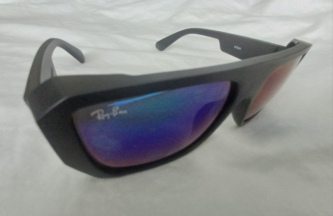 Pre-loved Ray Ban IZAZ (Category: Sunglasses & Eyewear) located in Quezon City. Submitted by mset.05011984 (Listing ID 1466233660, Image 2). Description: - Brand/Model: Ray-Ban Smart Sunglasses - Frame: Matte black with Ray-Ban logo on temples - Lenses: Blue and violet gradient, clean and scratch-free - Features: Built-in camera and audio in the arms - Condition: Solid hinges, smooth open/close, ready for daily wear.