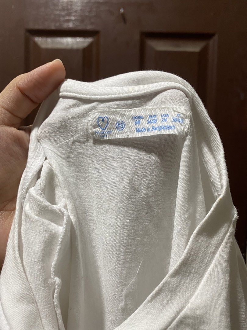 Primark White Short Sleeve Bodysuit (Category: Shirts) located in Calamba. Submitted by soleilcollections.ph (Listing ID 1466237330, Image 2). Description: - Brand: Primark - Size: XS (UK 6/8) - Color: Classic White - Material: Soft, stretchy cotton blend - Design: Crew neckline, fitted silhouette, snap button closure at the bottom - Condition: Clean and basic staple piece - Styling: Versatile for easy layering under jeans, skirts, or trousers.