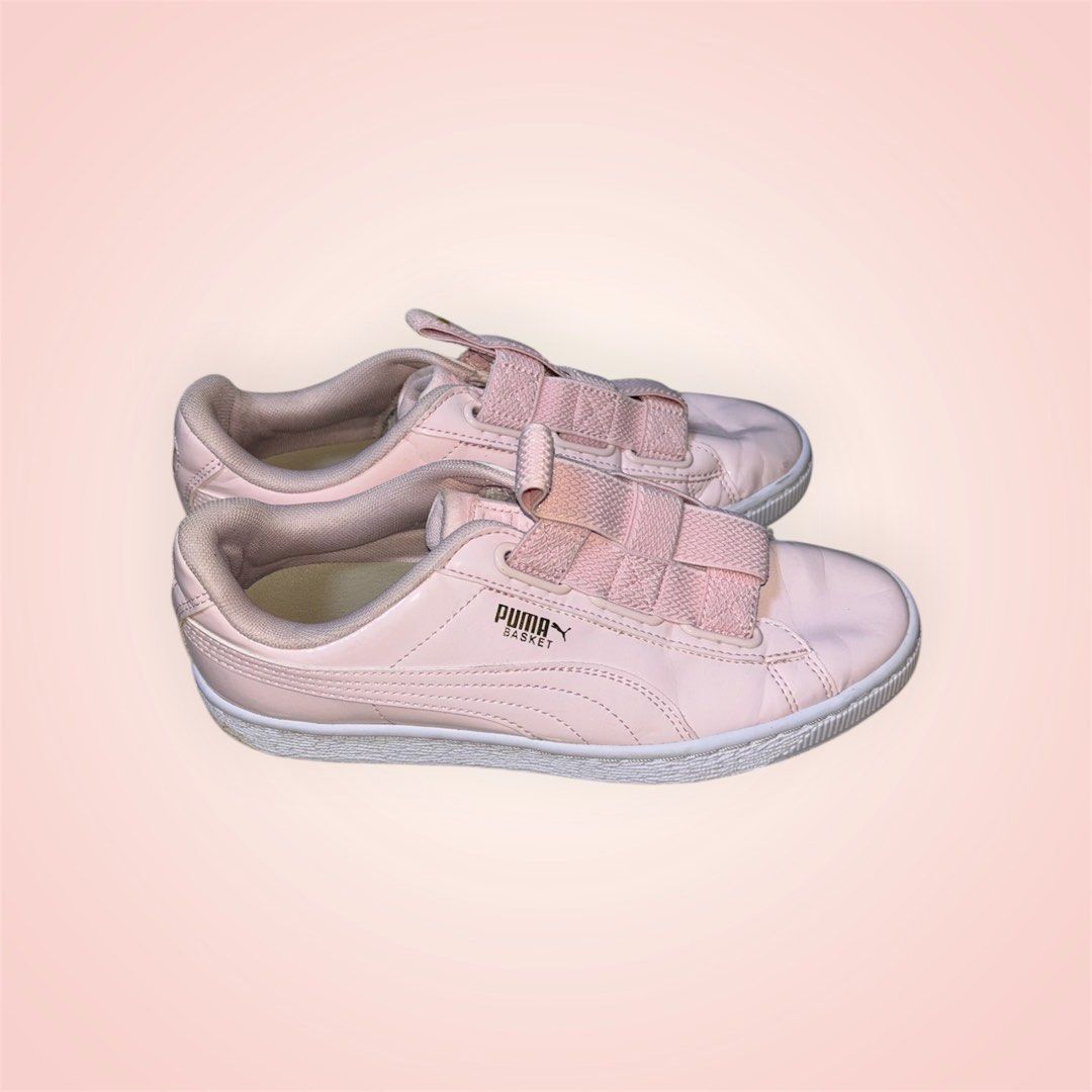 Puma Basket Heart Pink Sneakers (Category: Sneakers) located in Rosario. Submitted by preloveditems2002 (Listing ID 1466240738, Image 2). Description: - Brand: Puma - Style: Basket Sneakers - Color: Pink with metallic gold branding - Material: Glossy patent leather upper, white rubber sole - Features: Trendy wide ribbon laces and slip-on elastic band design - Condition: Clean look overall, great for casual daily wear - US 7.5.