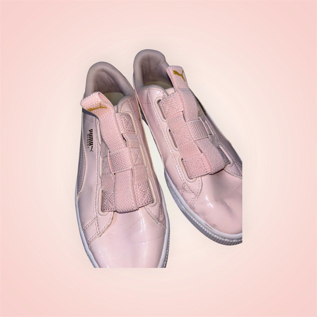 Puma Basket Heart Pink Sneakers (Category: Sneakers) located in Rosario. Submitted by preloveditems2002 (Listing ID 1466240738, Image 3). Description: - Brand: Puma - Style: Basket Sneakers - Color: Pink with metallic gold branding - Material: Glossy patent leather upper, white rubber sole - Features: Trendy wide ribbon laces and slip-on elastic band design - Condition: Clean look overall, great for casual daily wear - US 7.5.