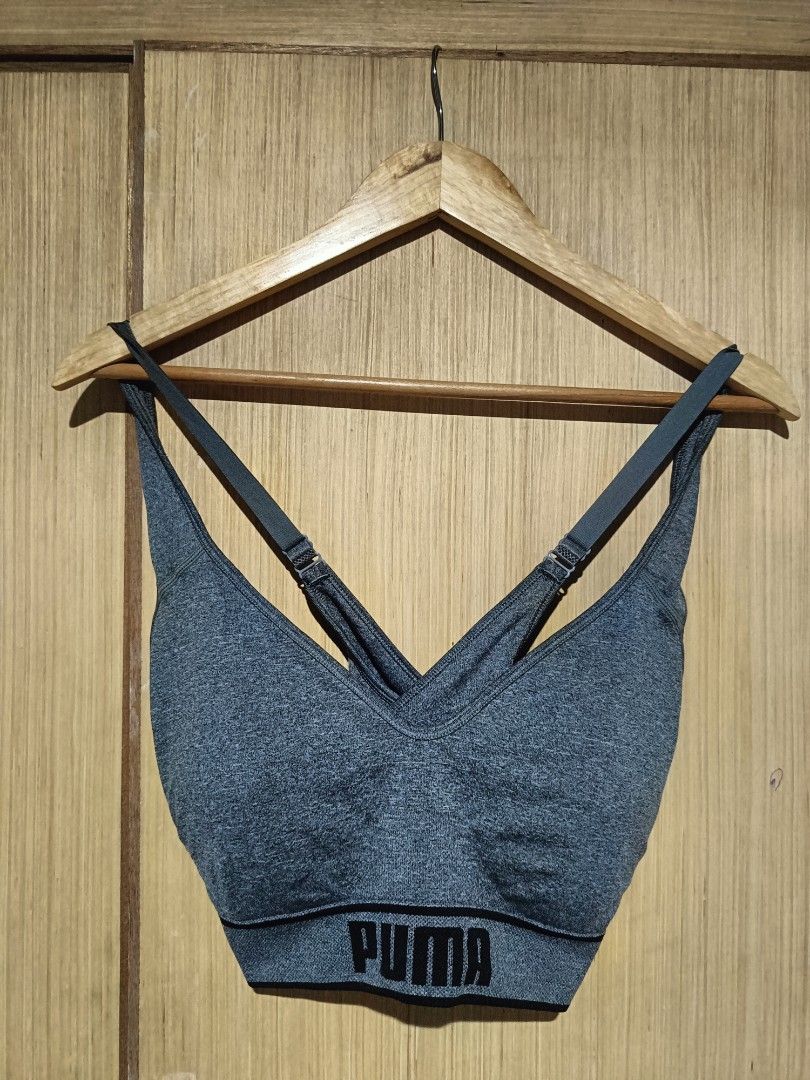 Puma Heather Grey Sports Bra (Category: Activewear) located in Angeles City. Submitted by faeyhang0223 (Listing ID 1466266901, Image 1). Description: Grey heather sports bra from Puma. V-neck style with adjustable criss-cross straps in the back. Black elastic underband featuring the bold Puma logo all around. Classic athletic piece, comfortable and supportive for workouts or daily wear. Good stretch material, clean finish, and neat stitching..