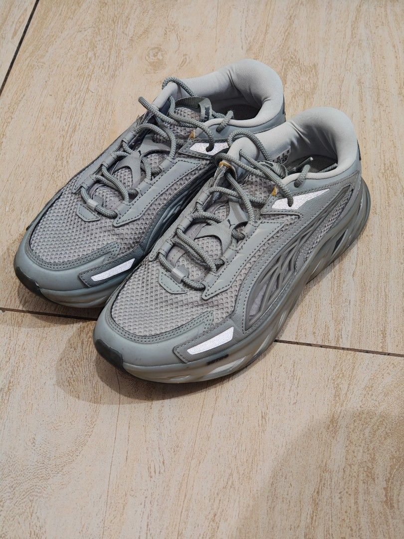 Puma Exotek Gray Size UK 9 US 10 (Category: Sneakers) located in Quezon City. Submitted by aamedo (Listing ID 1466331400, Image 3). Description: - Brand/Model: Puma sneakers - Color: Grey with mesh panels and reflective details - Design: Chunky molded sole with textured traction pattern - Closure: Standard lace-up fastening - Size: UK 9 / EUR 43 / US 10 - Condition: Normal signs of wear on the outer soles from regular use.