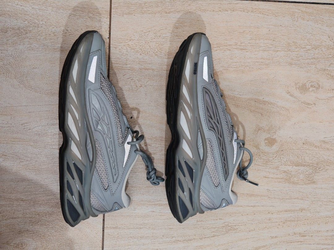 Puma Exotek Gray Size UK 9 US 10 (Category: Sneakers) located in Quezon City. Submitted by aamedo (Listing ID 1466331400, Image 2). Description: - Brand/Model: Puma sneakers - Color: Grey with mesh panels and reflective details - Design: Chunky molded sole with textured traction pattern - Closure: Standard lace-up fastening - Size: UK 9 / EUR 43 / US 10 - Condition: Normal signs of wear on the outer soles from regular use.