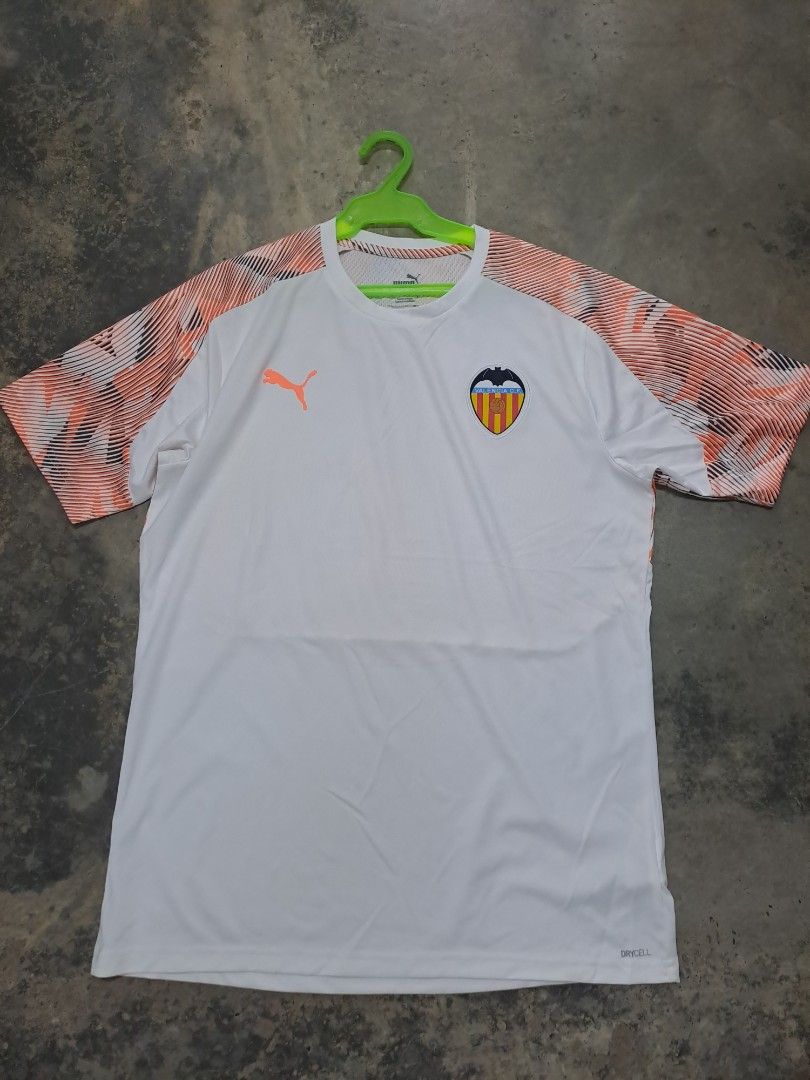 Puma Valencia CF White Orange Jersey (Category: Activewear) located in Puerto Princesa. Submitted by jercksthriftph (Listing ID 1466330519, Image 1). Description: Puma Valencia CF football jersey in white with orange patterned sleeves. Size L, made in Cambodia. Short sleeves, crew neck, dryCELL technology fabric. Club crest and Puma logo printed on the chest. Style number 756189-11..