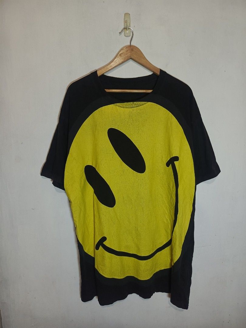 RAF SIMONS SS20 OVERSIZED SMILEY TEE (Category: Tshirts & Polo Shirts ) located in Baguio. Submitted by 074thriftmania (Listing ID 1466166841, Image 1). Description: - Brand/Collection: Raf Simons SS20 - Colorway: Black and yellow with large smiley face graphic print - Size: Large (Oversized fit, short sleeves) - Material: 100% cotton, made in Turkey - Condition: Clean overall with normal wear and slight cracking on the graphic print length 33" w
