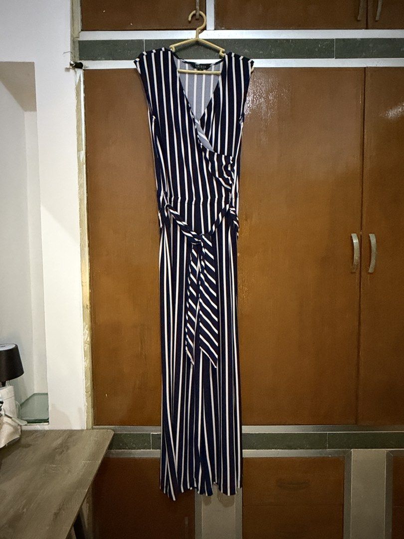 Ralph Lauren Navy Striped Jumpsuit (Category: Jumpsuits) located in Navotas City. Submitted by rahrahsevlau (Listing ID 1466172549, Image 1). Description: Ralph Lauren jumpsuit • PS (Petite Small) on tag but fits up to Large frames as fabric is super comfy stretchable! • Navy and white stripes (appears as black on photo but this is a beautiful navy blue) • Top feature a sleeveless, crossover v-neck neckline • Garterized waist with matching self-t